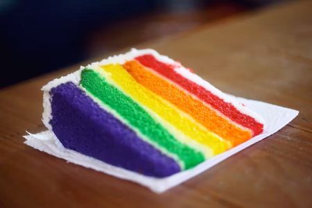 piece of rainbow coloured cake