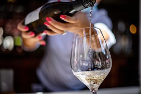 waitress pouring wine