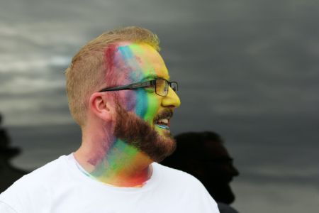 gay man with rainbow makeup