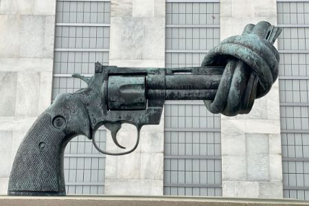 hand gun sculpture with twisted metal barrel